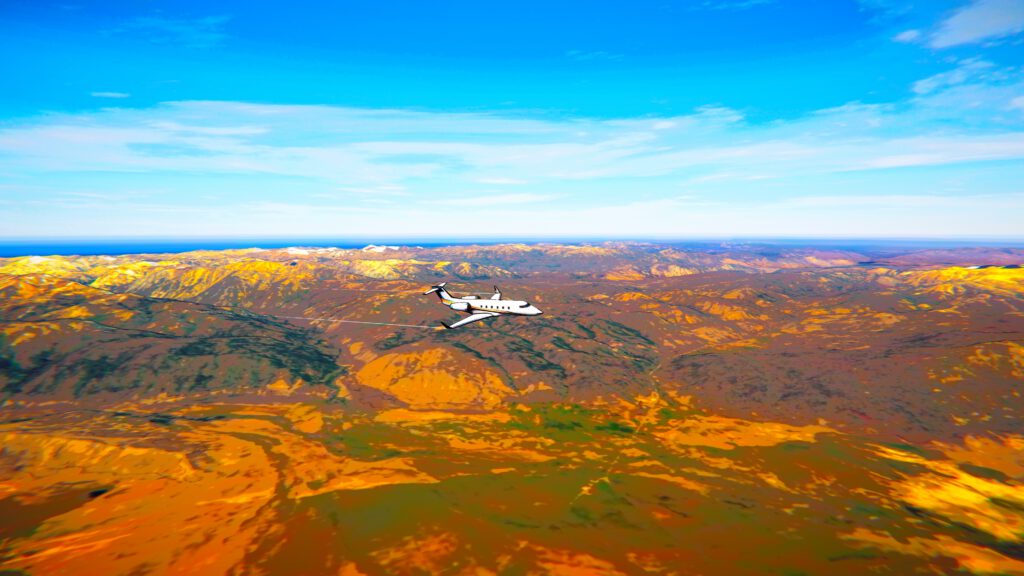 Business jet cruising over colorful mountains in Fly4Fun mode