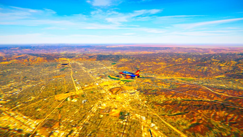 Colorful aerobatic jet flying over a city in Free Flight mode